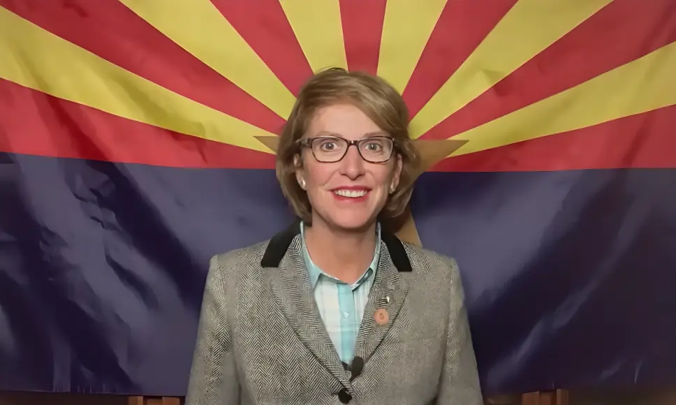 Wendy Nations stands in front of an Arizona state flag, sparking curiosity about why Wendy Nations left Channel 3.